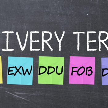 Delivery terms with adhesive notes on a blackboard